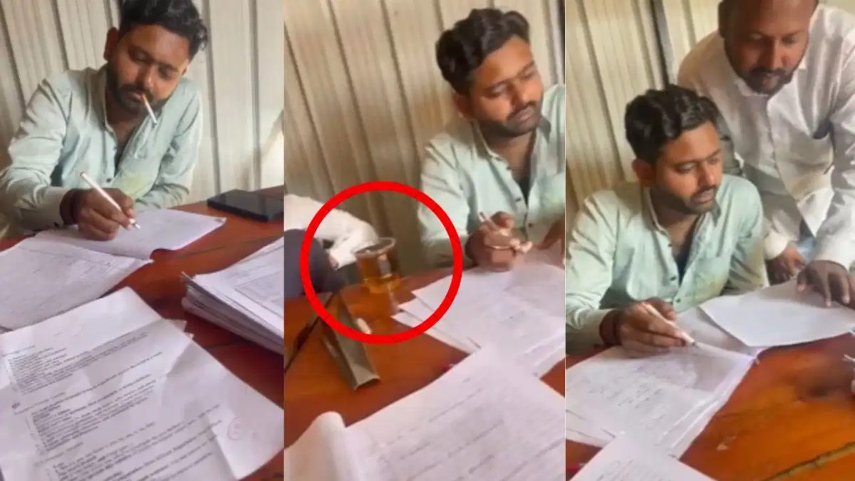 मुंह में सिरगेट, टेबल पर शराब और कॉपियों की चेकिंग…, शराब के नशे में धुत टीचर ने सिगरेट पीते हुए जांची बच्चों की कॉपियां
